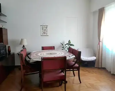 a dining room with a table and chairs at Victoria Flat in Athens