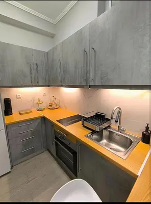 a kitchen with a sink and a counter top at Stylish Urban Studio στο Γουδί in Athens