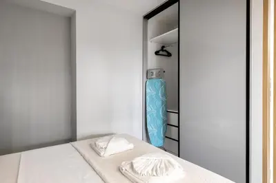 a room with a bed and a blue vase at Clavé - Deluxe Studio in Athens in Athens