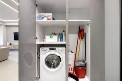 a laundry room with a washing machine in a room at Clavé - Deluxe Studio in Athens in Athens