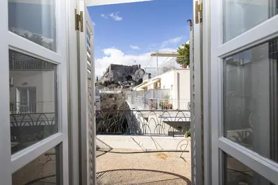 an open door to a balcony with a view at Paul in Athens