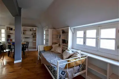 a living room with a couch and a window at Paul in Athens