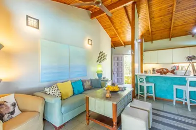 a living room with a couch and a table at Iliachtida House in Sounio