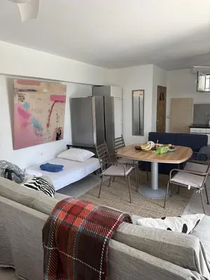 a living room with a couch and a table at ART BLUE RESIDENCE Pool in Aghia Marina