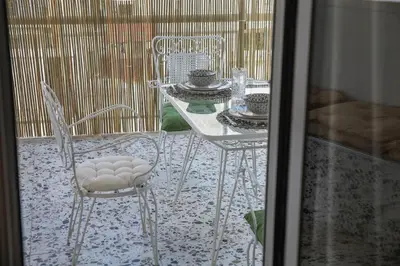 a table and chairs sitting on a patio at Bohemian Sunny apt Athens Center in Athens