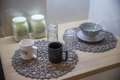 a table with two coffee mugs and a tray with cups at Bohemian Sunny apt Athens Center in Athens