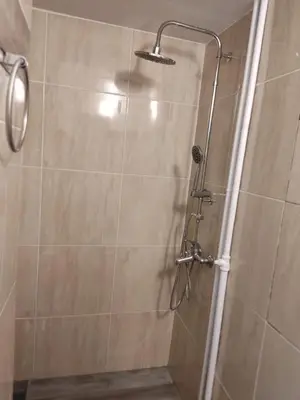 a shower with a glass door in a bathroom at Gousa Urban Stay 2 Min Walk to Metro in Athens