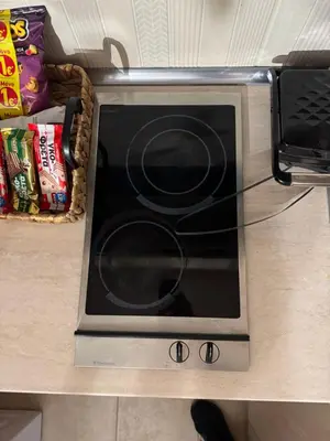 a microwave oven sitting on top of a counter at Aiolos cozy GLYFADA near the centre in Athens