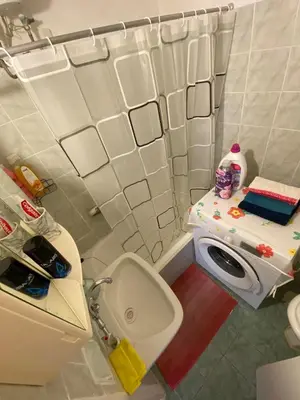 a small bathroom with a toilet and a sink at Cosy full apartment in Athens
