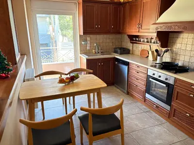 a kitchen with a table with a bowl of fruit on it at Purerest Entire Private Villa in Athens