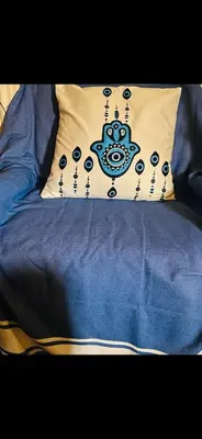a bed with a blue comforter and a pillow at Master private room in Athens