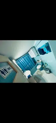 a bedroom with a desk with a laptop computer on it at Master private room in Athens