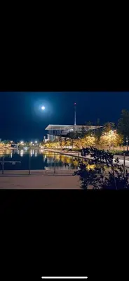 a view of a building at night with lights at Master private room in Athens