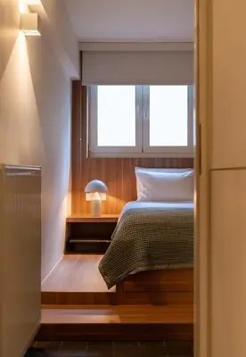 a bedroom with a bed and a window at ERE Acropolis Courtyard in Athens