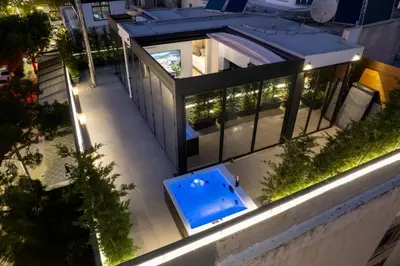 an aerial view of a house with a swimming pool at Penthouse in the Heart of Glyfada in Athens