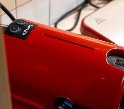 a close up of a red sewing machine at Zeas Yacht View in Piraeus