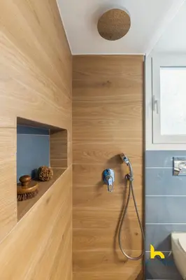 a bathroom with a shower with wooden walls at Modern Studio Escape near Seaside & Marina! in Athens