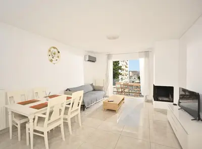 a white living room with a table and a couch at Lux Lux & modern Apt 5 min Piraeus port - Free Parking in Piraeus