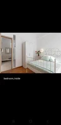 a bedroom with a bed and a mirror at Dreaming of Greece a4 in Athens