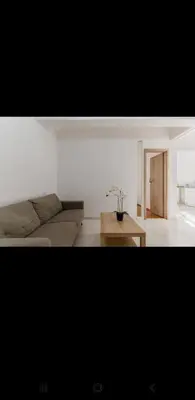 a living room with a couch and a coffee table at Dreaming of Greece a4 in Athens