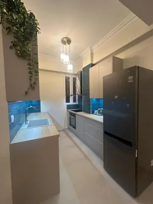 a kitchen with a black refrigerator and a sink at Kiafas 5 Apartment Athens in Athens