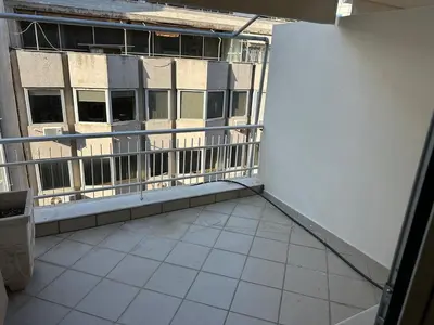 an empty balcony of a building with windows at Brown balcony suite no 2 Piraeus Port in Piraeus