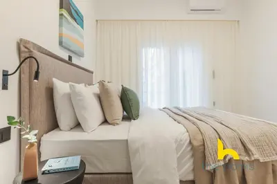 a bedroom with a bed and a window at Peacefull Family APT W Sunny Balcony in Kallithea in Athens