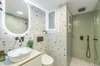 a bathroom with a sink and a shower at Peacefull Family APT W Sunny Balcony in Kallithea in Athens