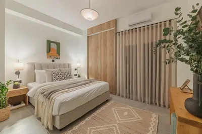 a bedroom with a bed and a large window at Peacefull Family APT W Sunny Balcony in Kallithea in Athens