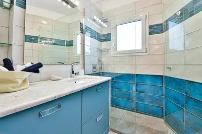 a bathroom with a sink and a mirror at Cosy modern flat under the Acropolis in Athens
