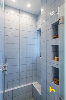 a bathroom with a shower with blue tiles at Stylish Love Nest W Balcony in Heart of Koukaki! in Athens