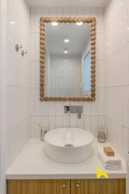 a bathroom with a sink and a mirror at Stylish Love Nest W Balcony in Heart of Koukaki! in Athens