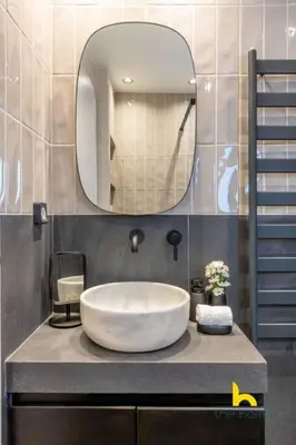 a bathroom with a large white sink and a mirror at Top-Floor Oasis, King-Bed & Whirlpool, Acropolis! in Athens