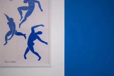 two framed silhouettes of a surfer on a wall at Ella's Athenian Home in Athens