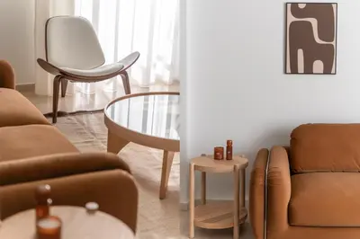 a living room with a couch and a chair and a table at Chalandri Bright 2BR Apartment by UPSTREET in Athens