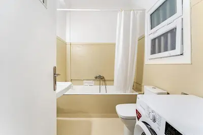 a bathroom with a tub and a toilet and a sink at Boutique 5BDT-3 ΒATH Apt with Eclectic Style- Acropolis in Athens