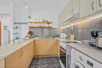 a kitchen with a sink and a washing machine at h2h Levandre Kallithea near Metropolitan, in Athens
