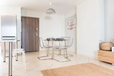 a living room with a table and two chairs at Urban Piraeus, Apartment No 2 in Piraeus