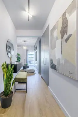 a living room with a large painting on the wall at 50 Shades of Athens, Kingsize Suite with Jacuzzi! in Athens