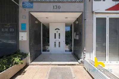 an entrance to a building with a white door at Aegean Blue Hideaway w Fireplace, near Acropolis in Athens