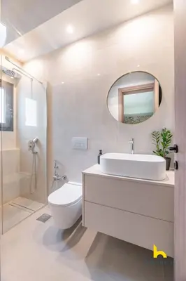 a bathroom with a sink and a toilet and a mirror at Majestic Acropolis View w Large Patio & Parking in Athens