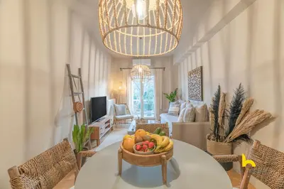a bowl of fruit on a table in a living room at Sun-Kissed Boho Haven with Whirlpool Bliss & Patio in Athens
