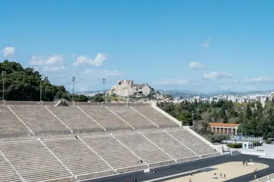 a group of empty bleachers in a stadium at Athens Green Apartments in Athens