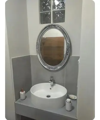 a bathroom with a white sink and a mirror at Neoclassic Rooms in Athens