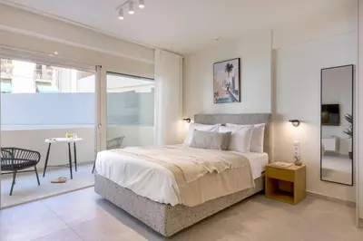 a bedroom with a large bed and a table at Boutique Studio Ι in Central Athens by MPS in Athens