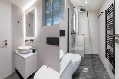 a white bathroom with a toilet and a sink at Boutique Studio Ι in Central Athens by MPS in Athens