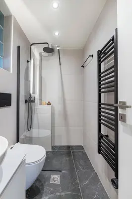 a white bathroom with a toilet and a sink at Boutique Studio Ι in Central Athens by MPS in Athens