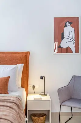 a bedroom with a bed and a chair at Elegant Studio Near Seafront- Palaio Faliro by MPS in Athens