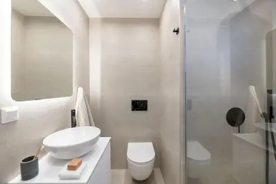 a bathroom with a sink and a toilet and a shower at Elegant Studio Near Seafront- Palaio Faliro by MPS in Athens