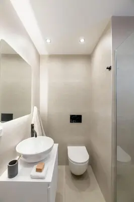 a white bathroom with a toilet and a sink at Elegant Studio Near Seafront- Palaio Faliro by MPS in Athens